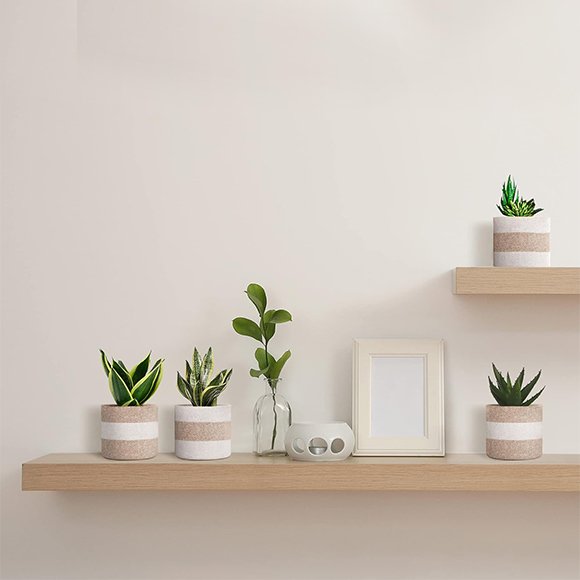 Natural jute planter for indoor and outdoor plants, featuring a simple and eco-friendly design.
